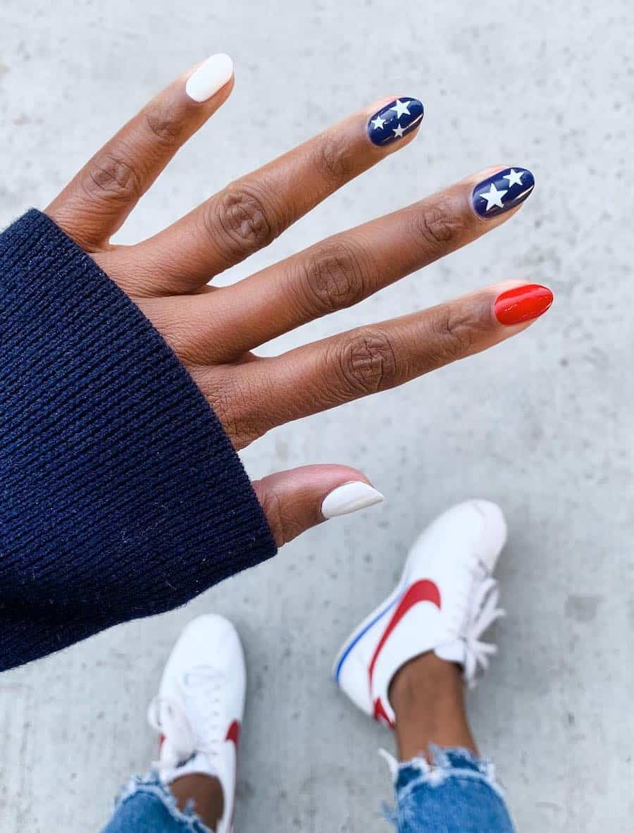 short red, white and blue nails with white stars on the blue nails