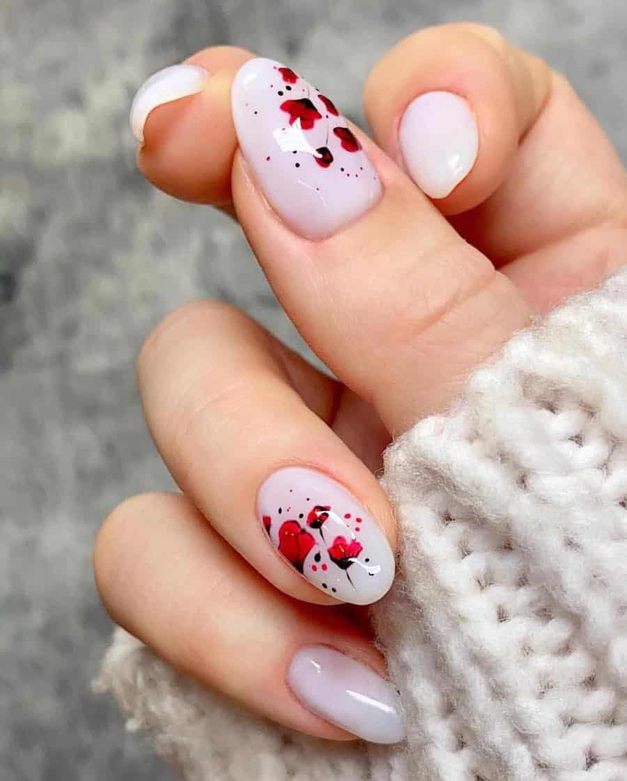 medium milky white almond nails with red poppy nail art