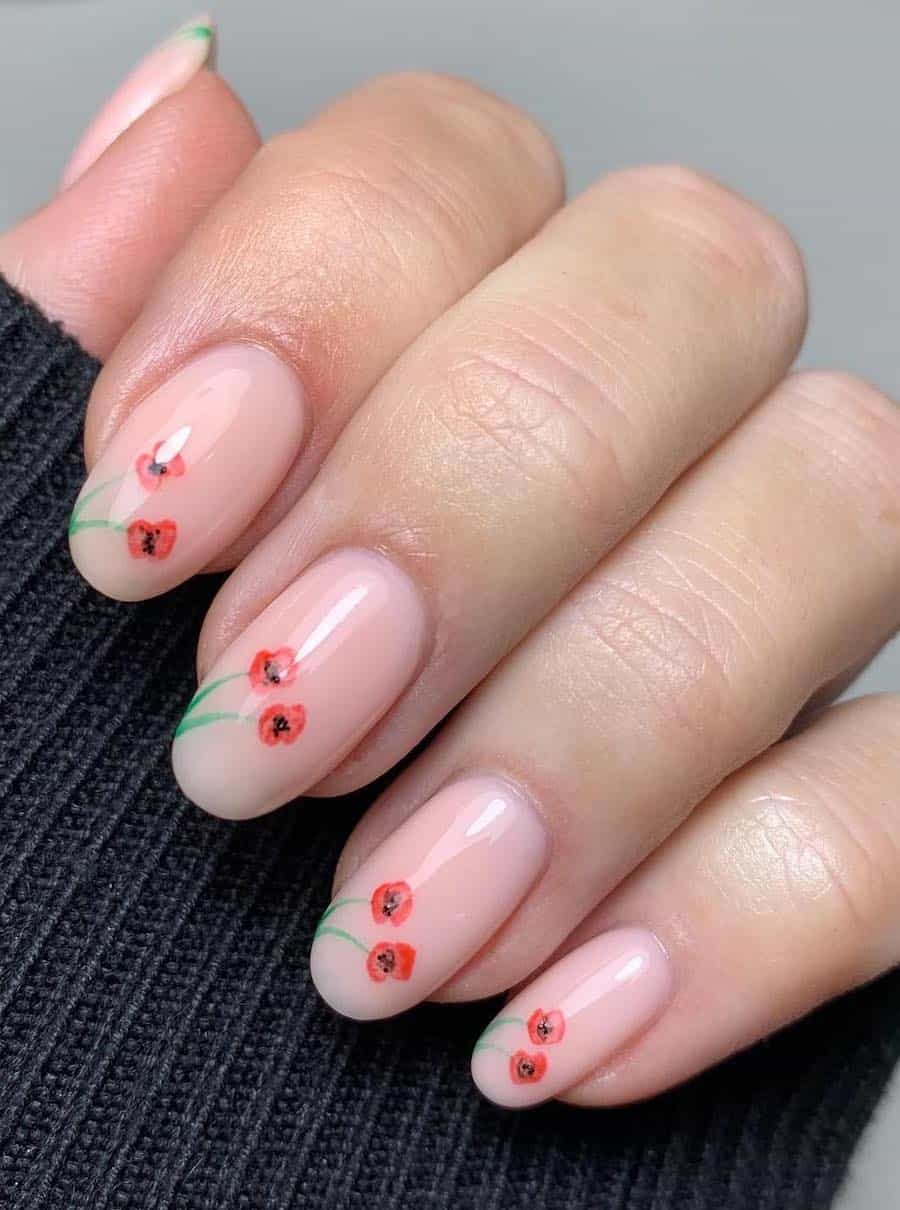 short round nude nails with red poppy nail art