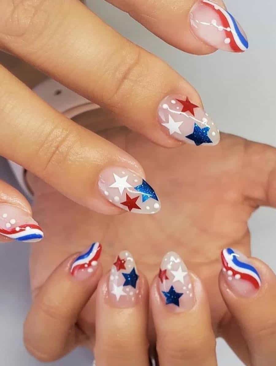 medium milky white almond nails featuring red, white, and blue waves and stars