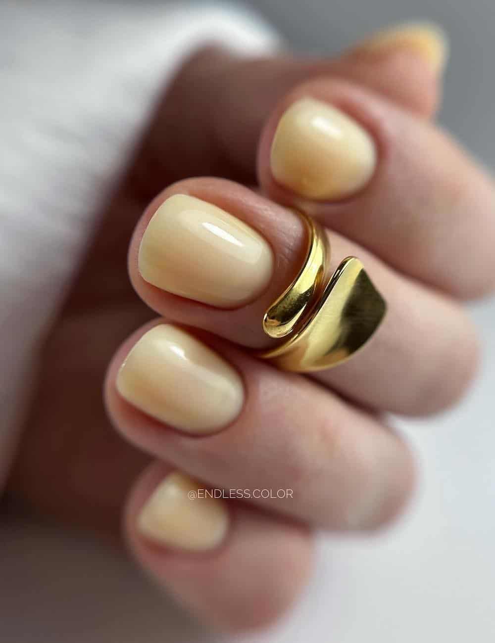 short round butter yellow nails