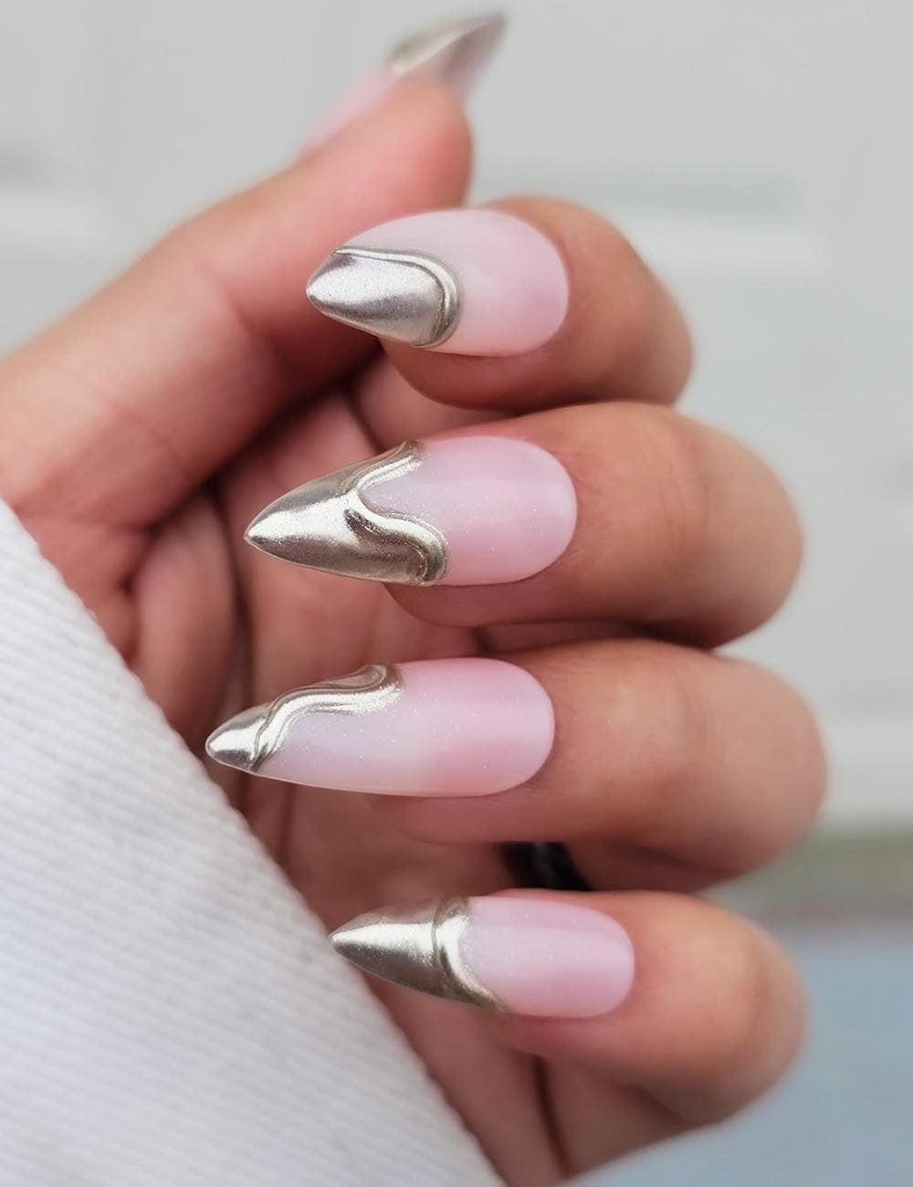 long nude pink stiletto nails with metallic silver dripping tips