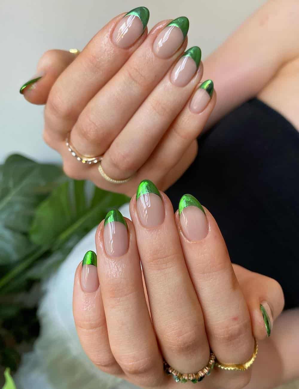 short round nude nails with bright chrome green tips