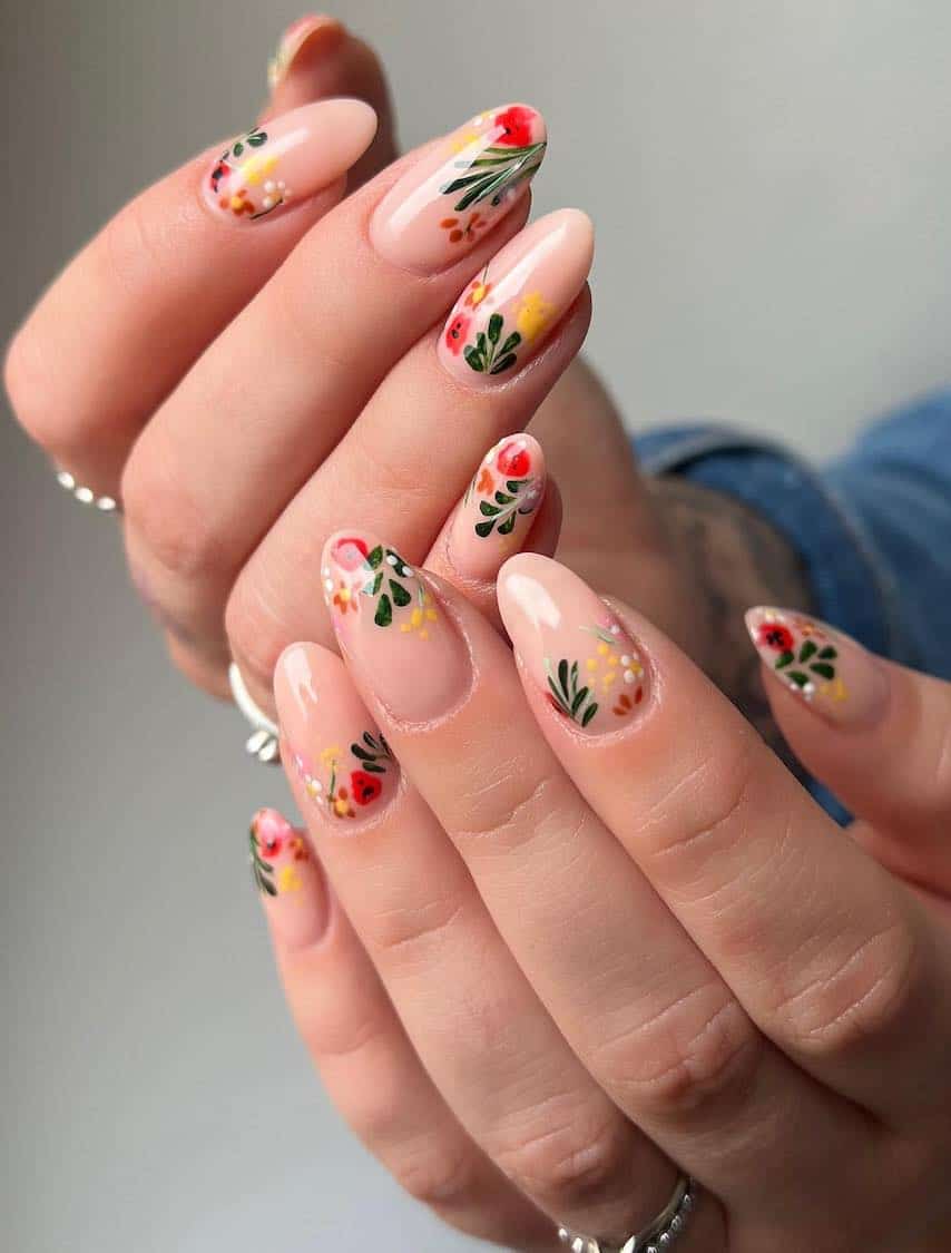 Long nude almond nails with colorful floral nailart