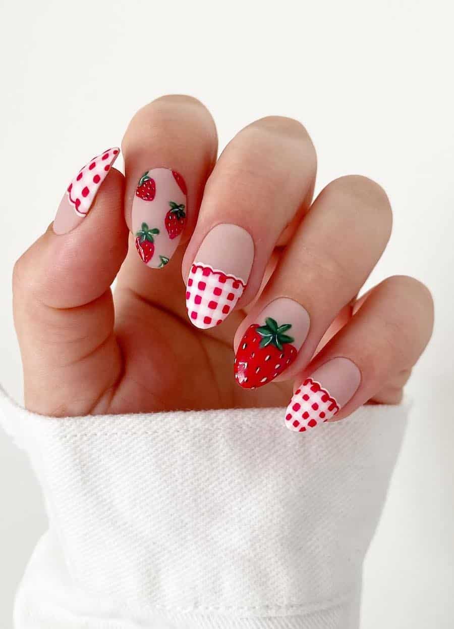 Medium nude almond nails with strawberry and gingham nail art