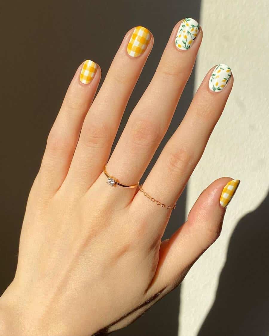 Short nails with white and yellow plaid details and white accent nails featuring lemon nail art