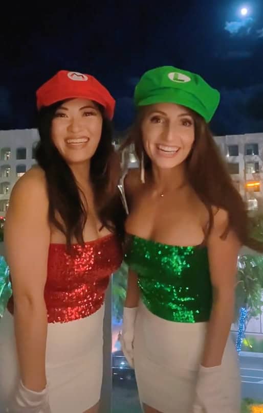 Two women dressed up as Maria and Luigi on Halloween.