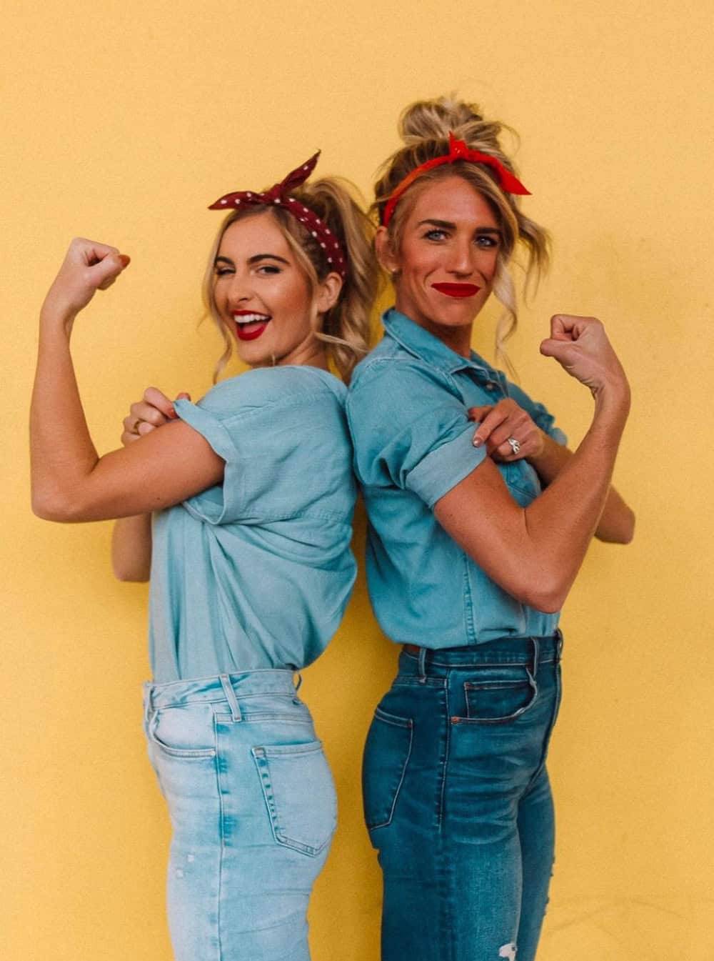 Two women dressed up as Rosie the Riveter for Halloween.