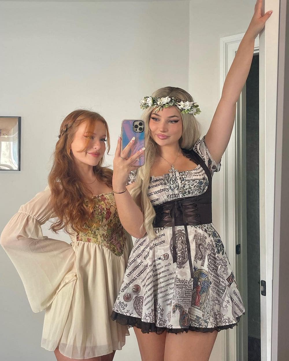 Two women dressed up as Renaissance girls on Halloween.