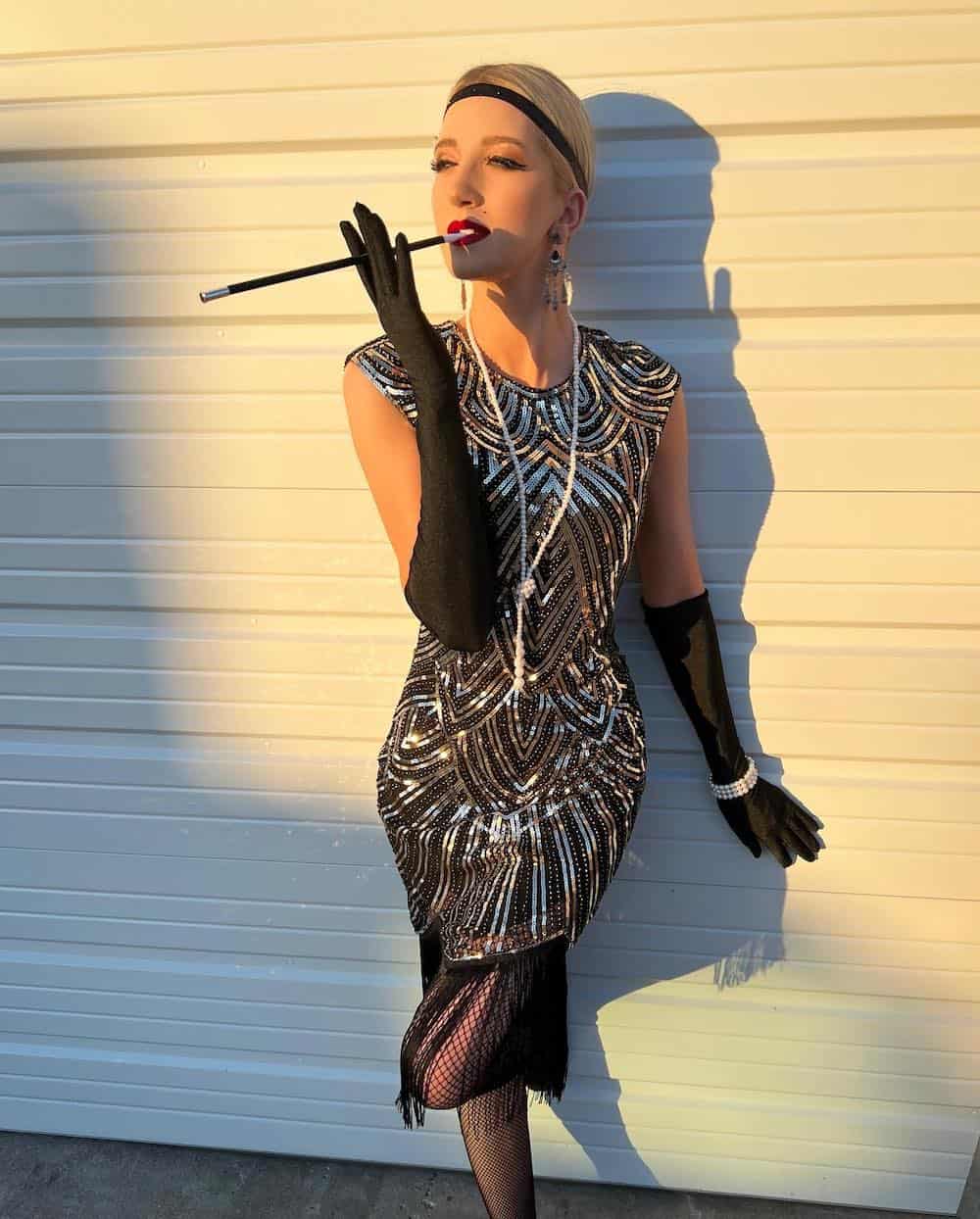 a woman dressed as a 20s flapper girl