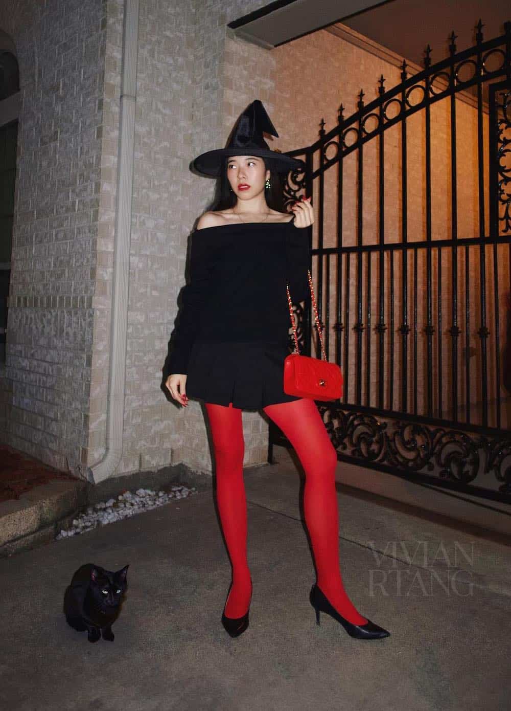 a woman dressed as a stylish witch