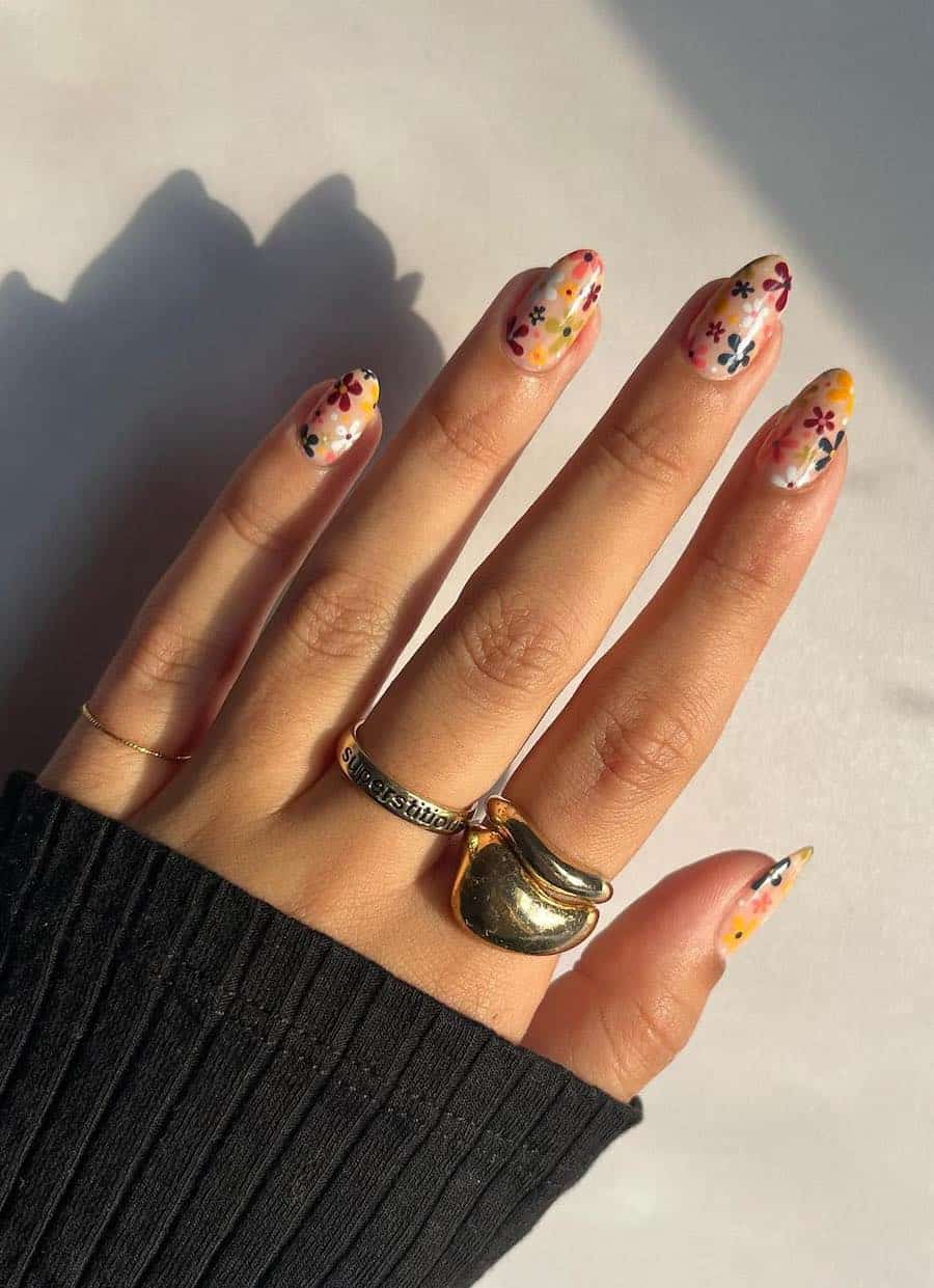 medium round nails featuring retro style floral art in a fall palette