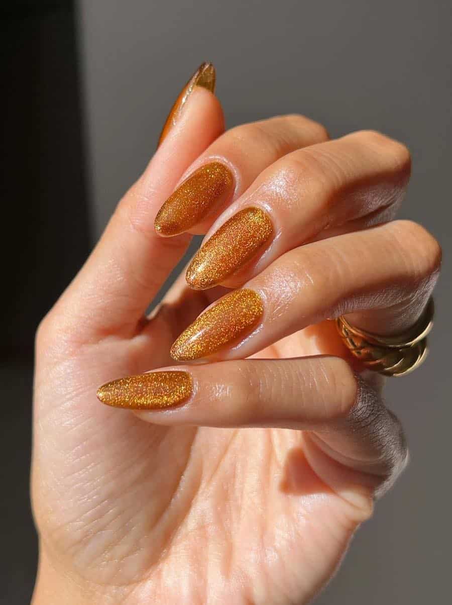 long almond nails featuring velvet copper polish