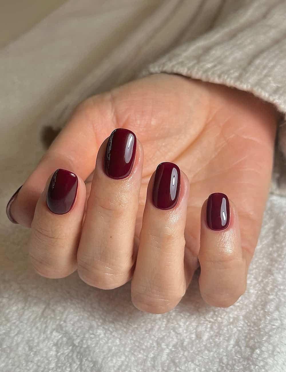 short squoval nails with cherry red polish