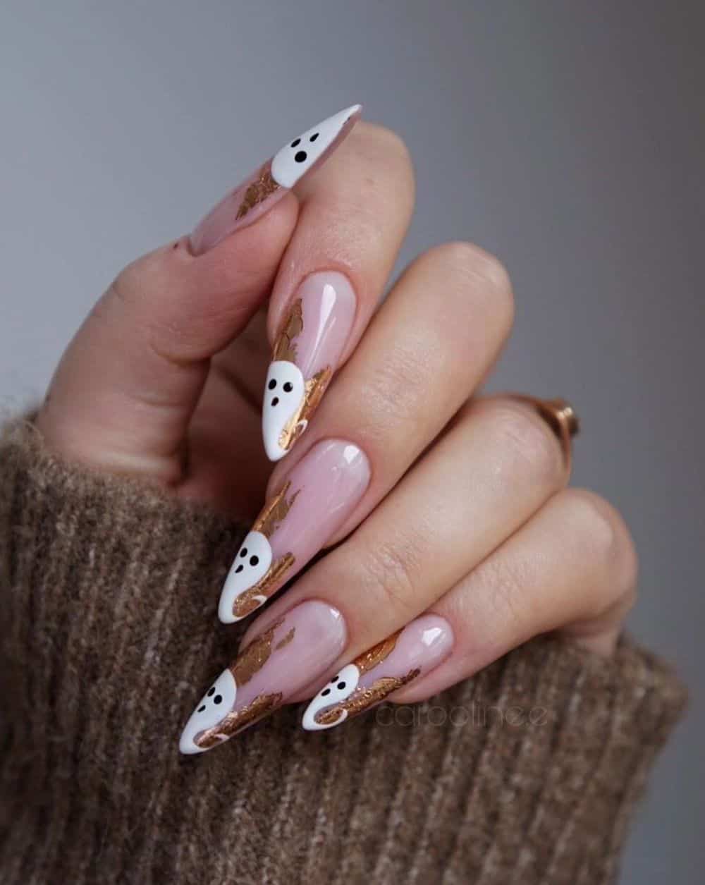 long nude pink almond nails with gold foil and white ghost tips