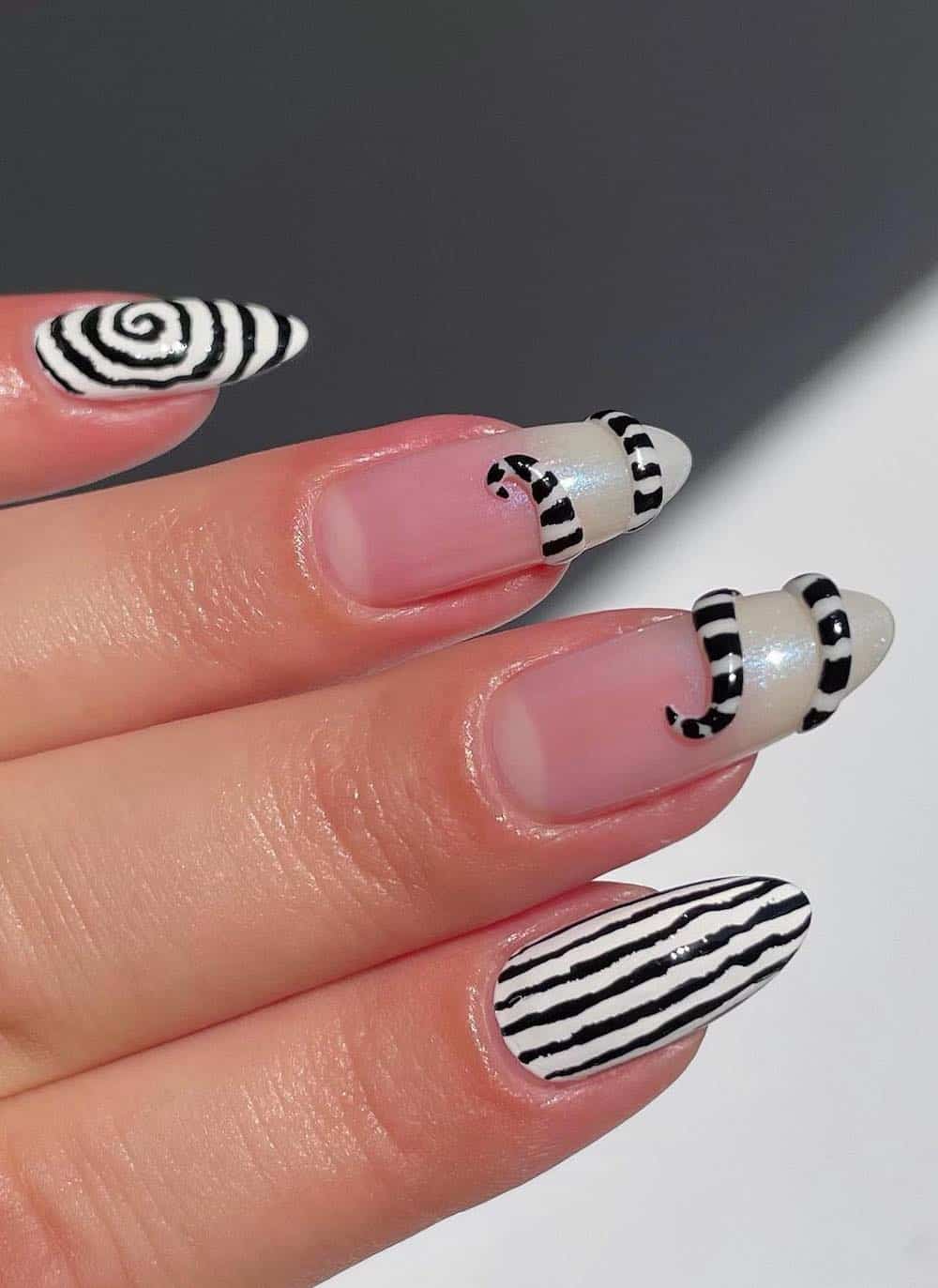 long almond nails with white and black striped nail art