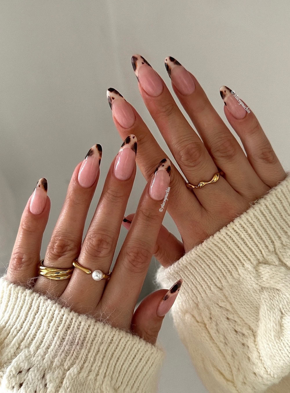 nude almond nails with animal print tips