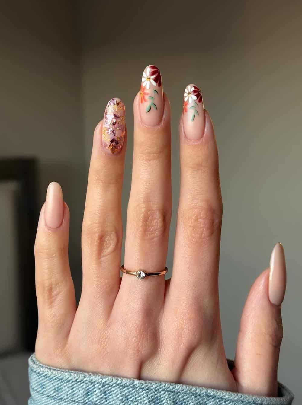 long nude nails with fall floral art and glitter accents