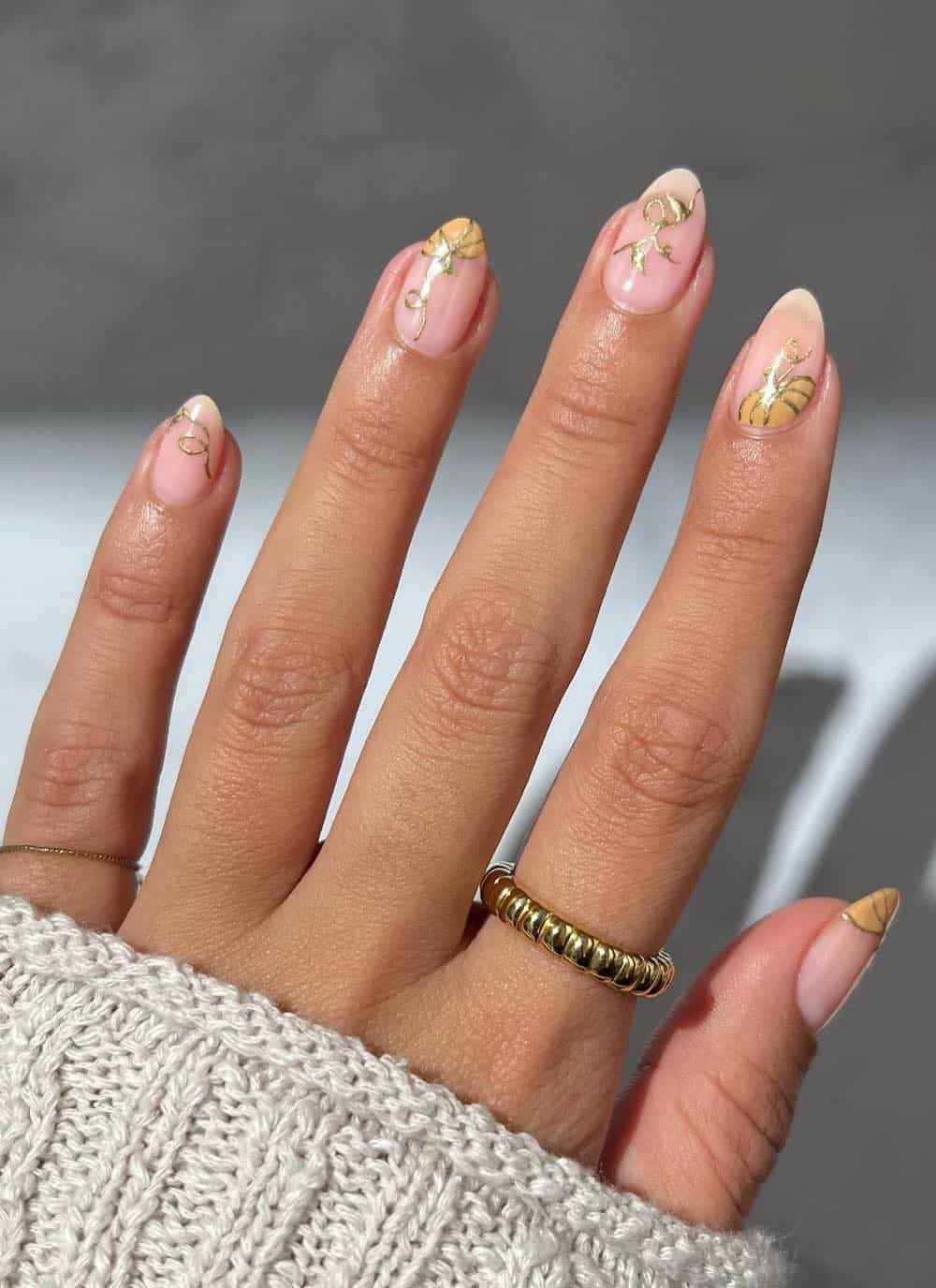 short nude nails with pumpkin nail art