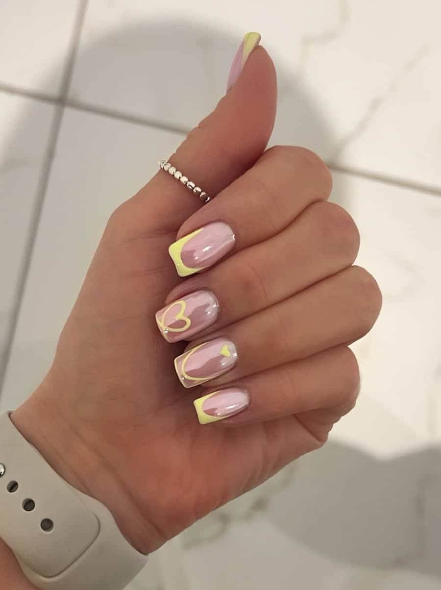 nude nails with yellow tips and accent art with chrome finish