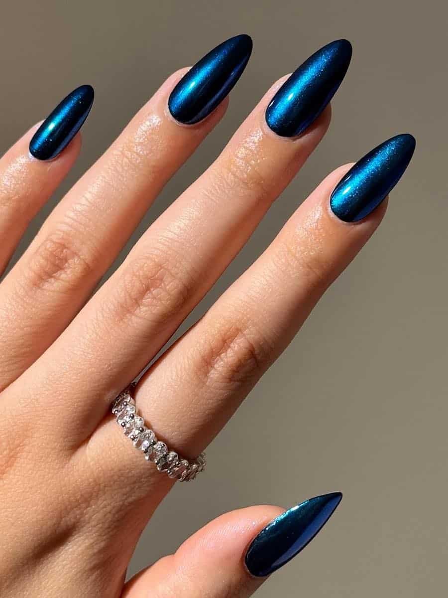 long metallic blue almond nails