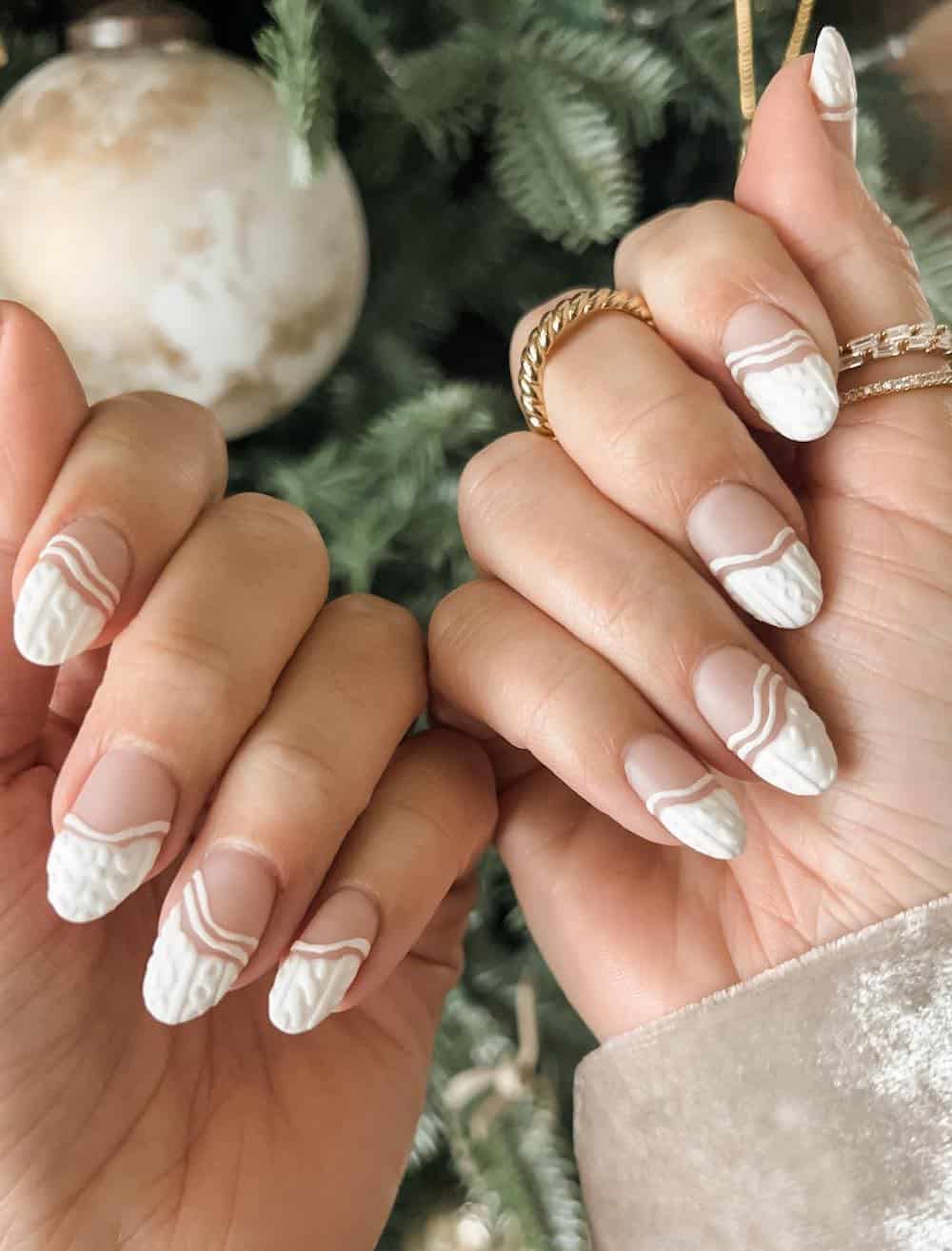 long round nails with wavy white tips and lines and sweater texture