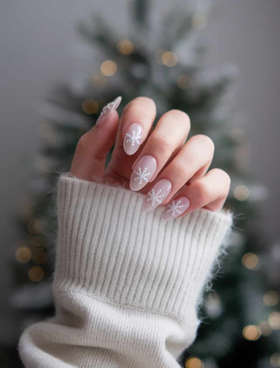 medium milky white almond nails with white snowflakes