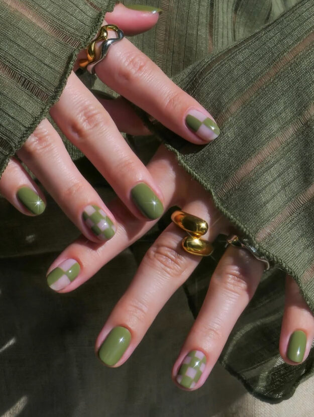 short olive green nails with checkerboard accent nails