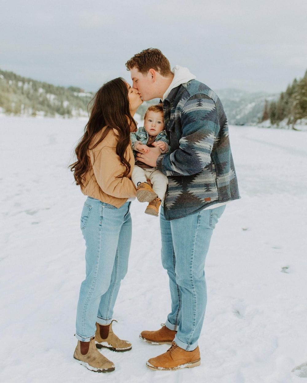 winter family photos featuring denim, comfy coats, and boots