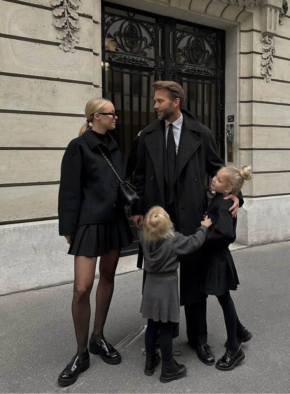 winter family photos featuring modern black winter wear
