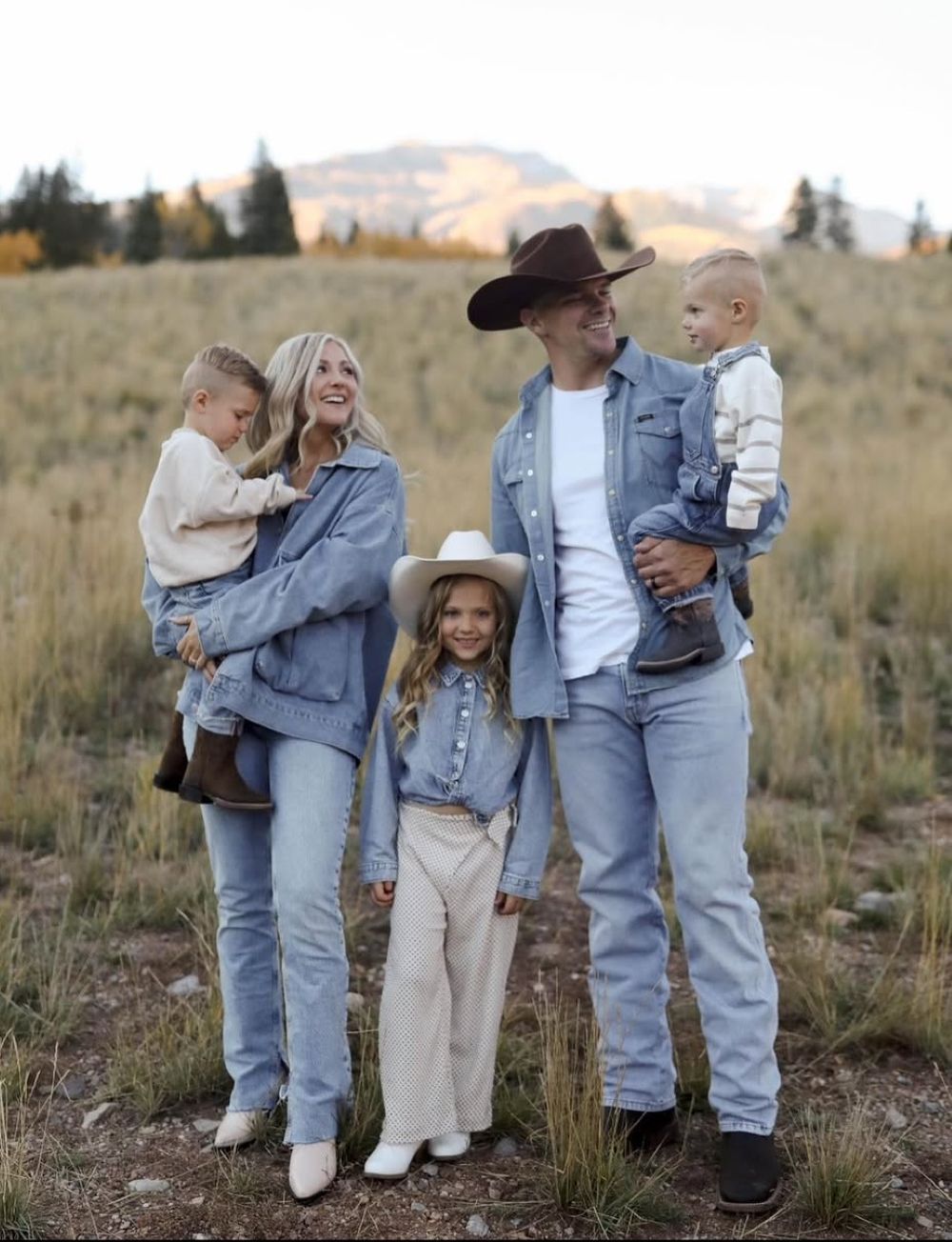 winter family photo outfits featuring light tones, denim, and western flair