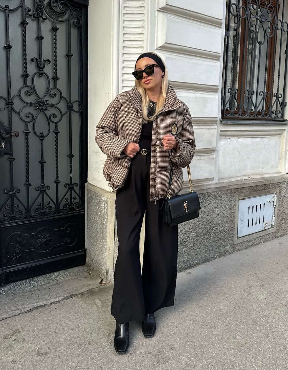 winter boots outfit with patterned puffer coat and black trousers