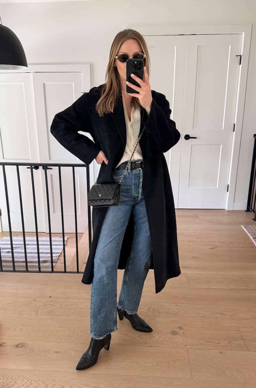 winter boots outfit with cardigan, wool coat, and denim