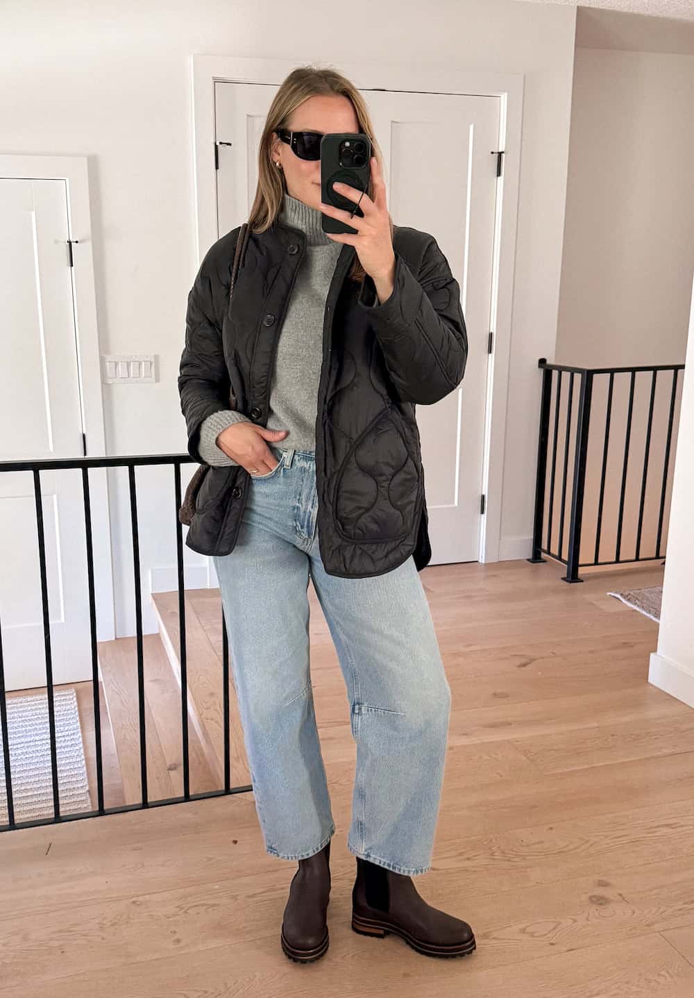 winter boots outfit with light denim and a quilted coat