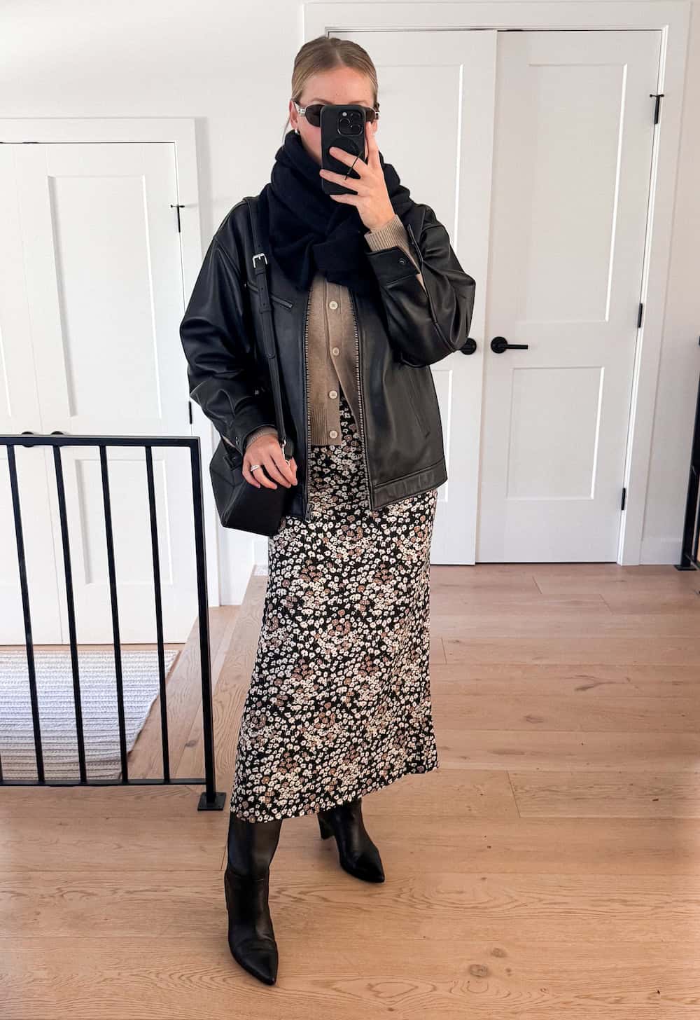 winter boots outfit with midi skirt and leather jacket